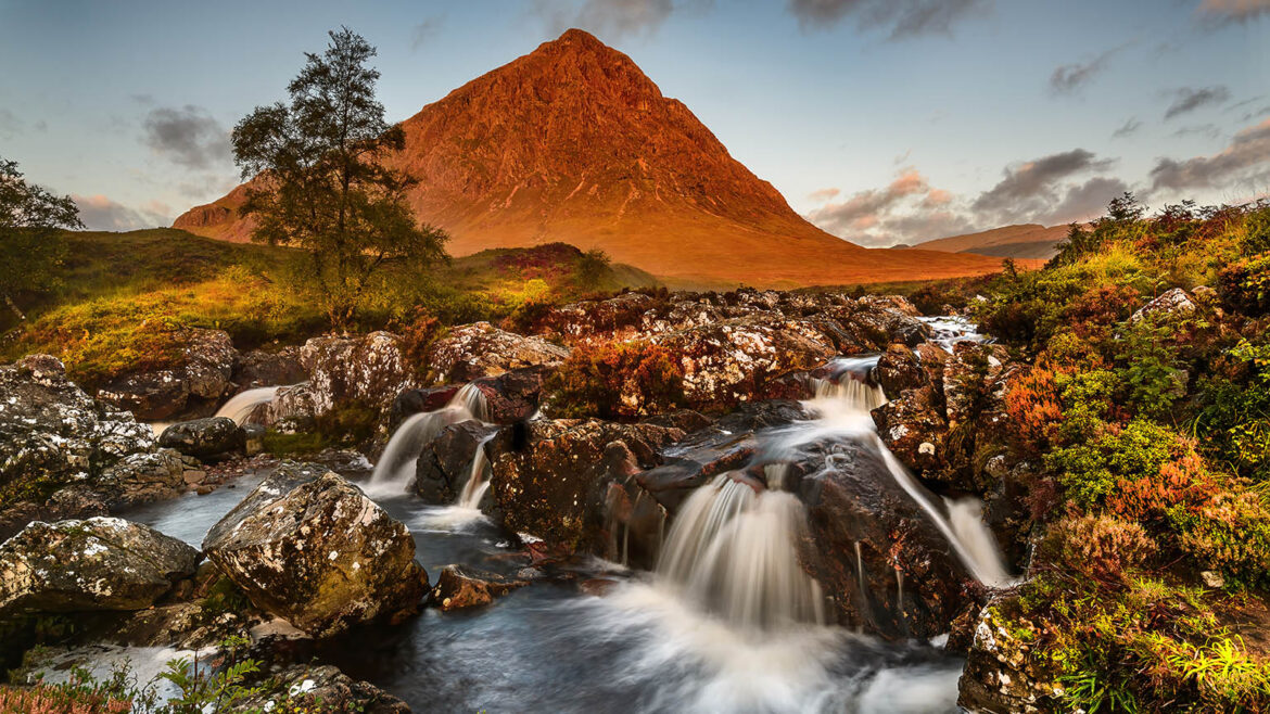 Buachaille Etive Mor immersed in red sunrise light.