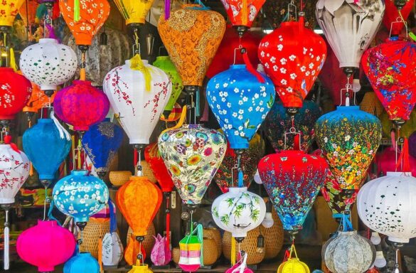 Colorful lanterns hanging at a market stall in Hoi An, Vietnam