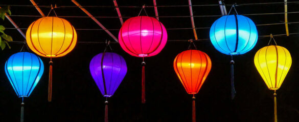 Colorful lanterns lit up at night in the streets of Hoi An, Vietnam