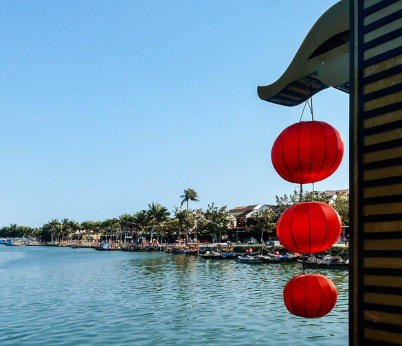 Red lanterns hanging with a view of the river in Hoi An, Vietnam