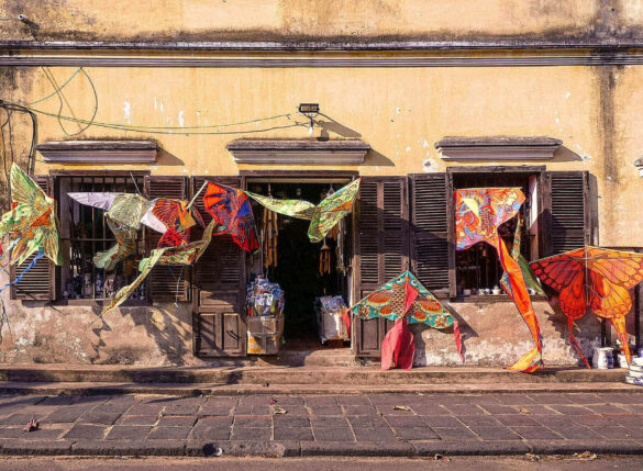 Colorful kites displayed in a quiet street of Hoi An, Vietnam