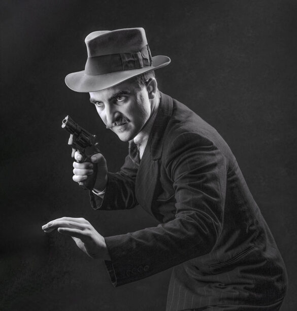 A vintage detective with a fedora and pistol, poised and alert.