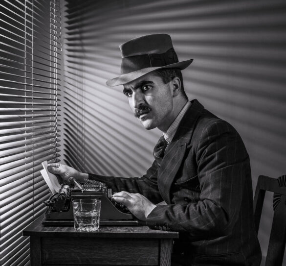 Vintage detective at a desk with typewriter and blinds casting shadows.